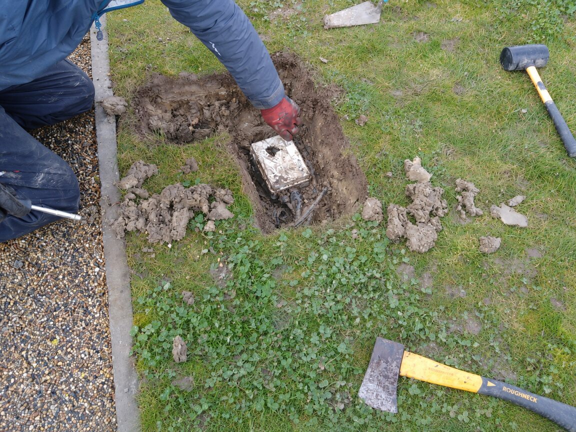 Excavated buried enclosure found while tracing failed pond electrics at a small commercial property